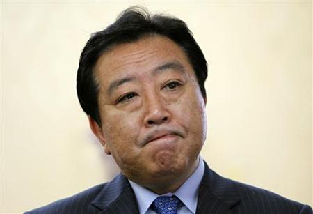 Japan's newly appointed Finance Minister Yoshihiko Noda reacts during a group interview at the ministry in Tokyo